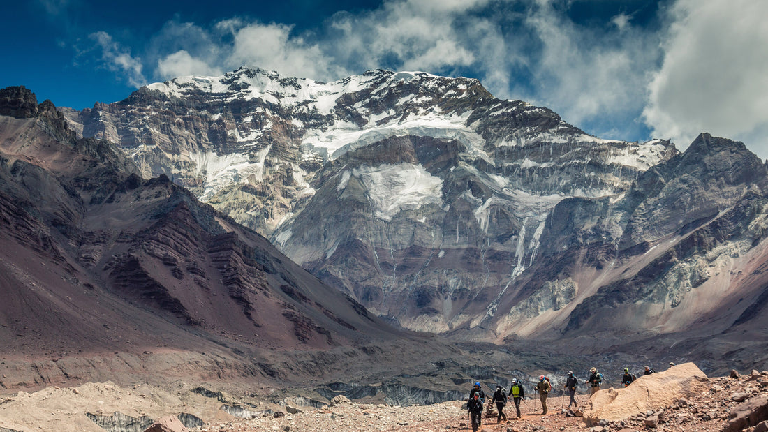 View of the south face of Aconcagua with trekkers in the foreground
