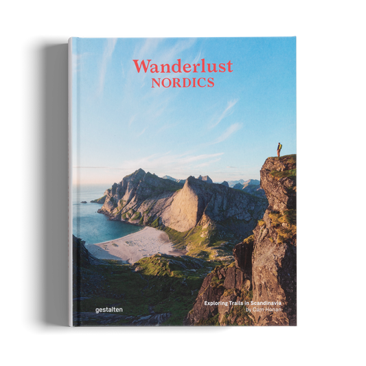 Book titled 'Wanderlust Nordics' with a scenic cover featuring cliffs and water.