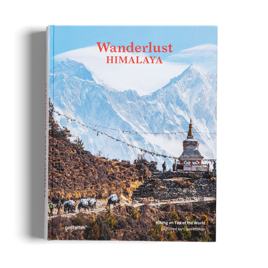 Book titled 'Wanderlust Himalaya' with a mountain and temple cover design.