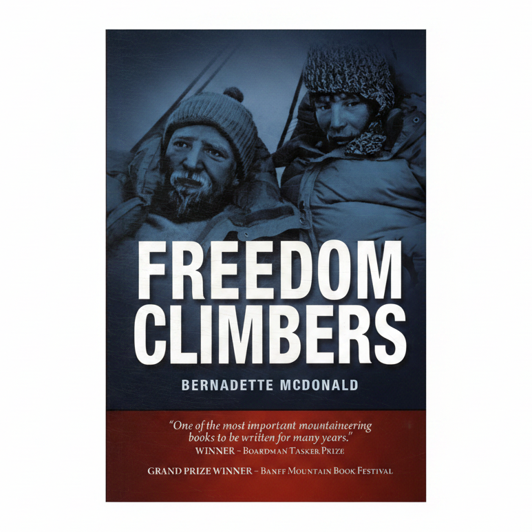 Book cover for 'Freedom Climbers' by Bernadette McDonald, featuring a dark blue-toned photograph of two mountaineers in winter gear with large white title text and a dark red review banner at the bottom.