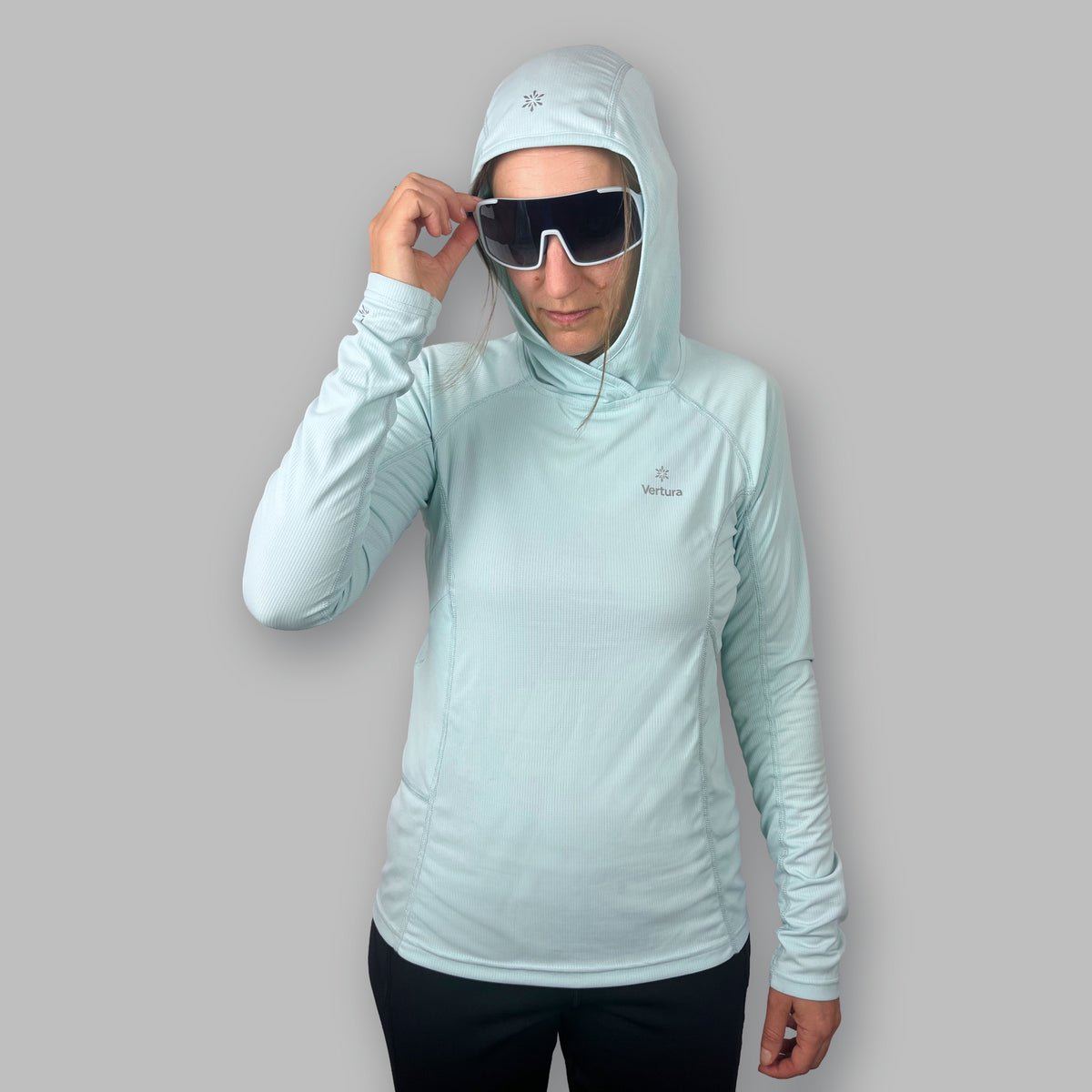 Women's Soltera Hoody in glacial green, front view with the hood up